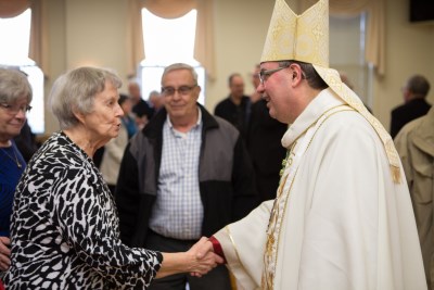 CSJ Sister greeting His Excellency Most Reverend Bishop Miehm