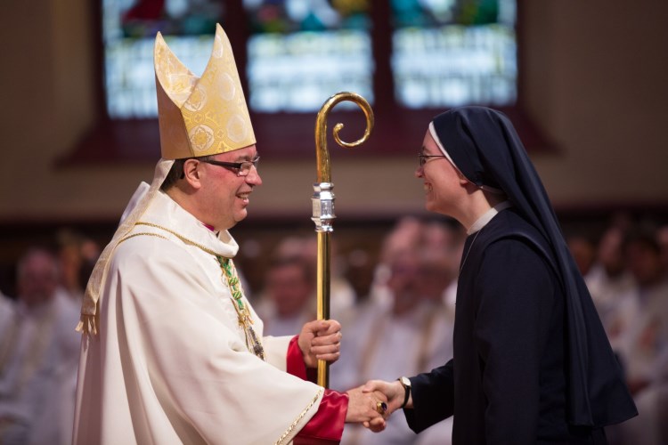 SOLI Sister greeting His Excellency Most Reverend Bishop Miehm