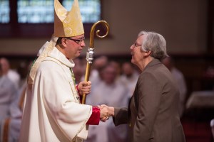Sr. Joyce Murray, CSJ greeting Bishop Miehm