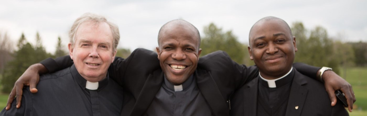 Three priests standing together