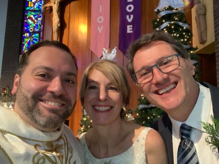 Priest and a couple getting married