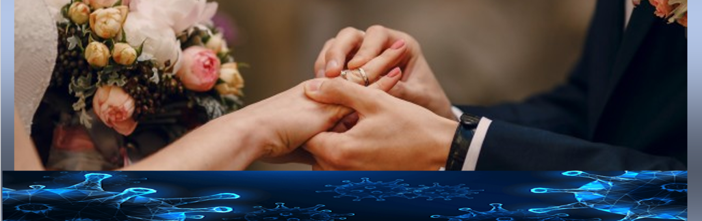 Groom putting wedding ring on bride's finger