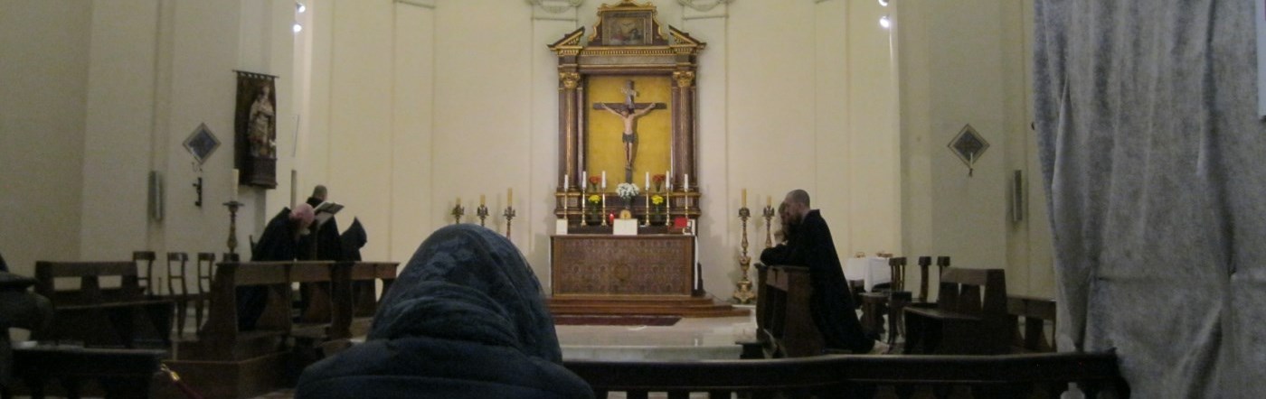 Monks praying Daily Christian Prayer in Norcia Benedictine monastery