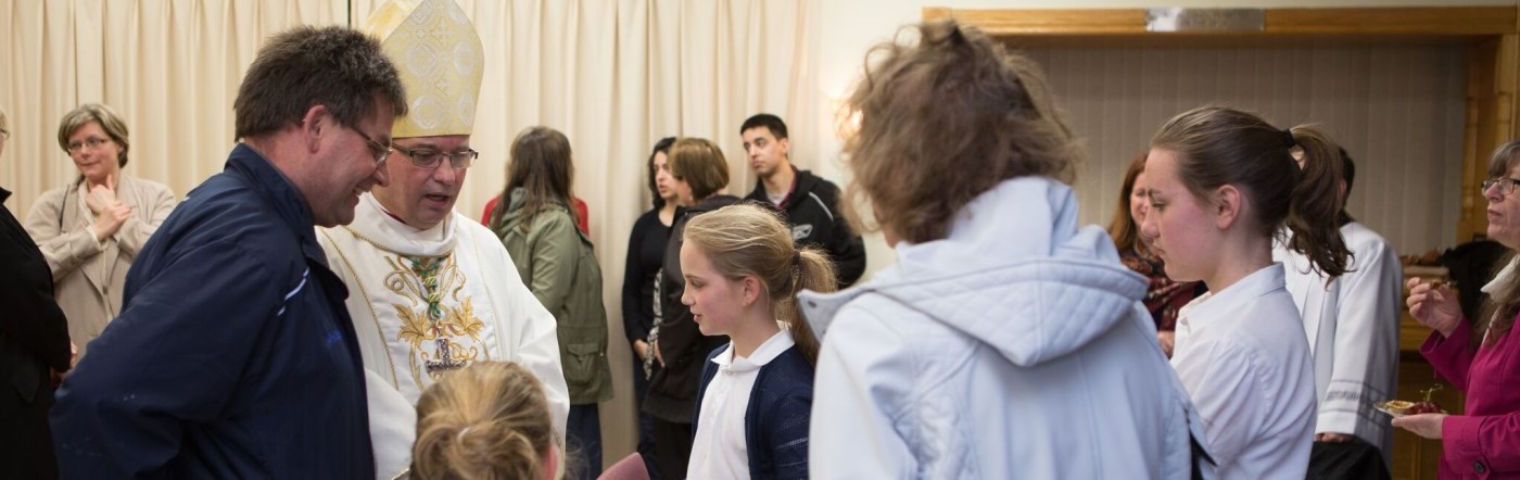 Bishop greeting the faithful