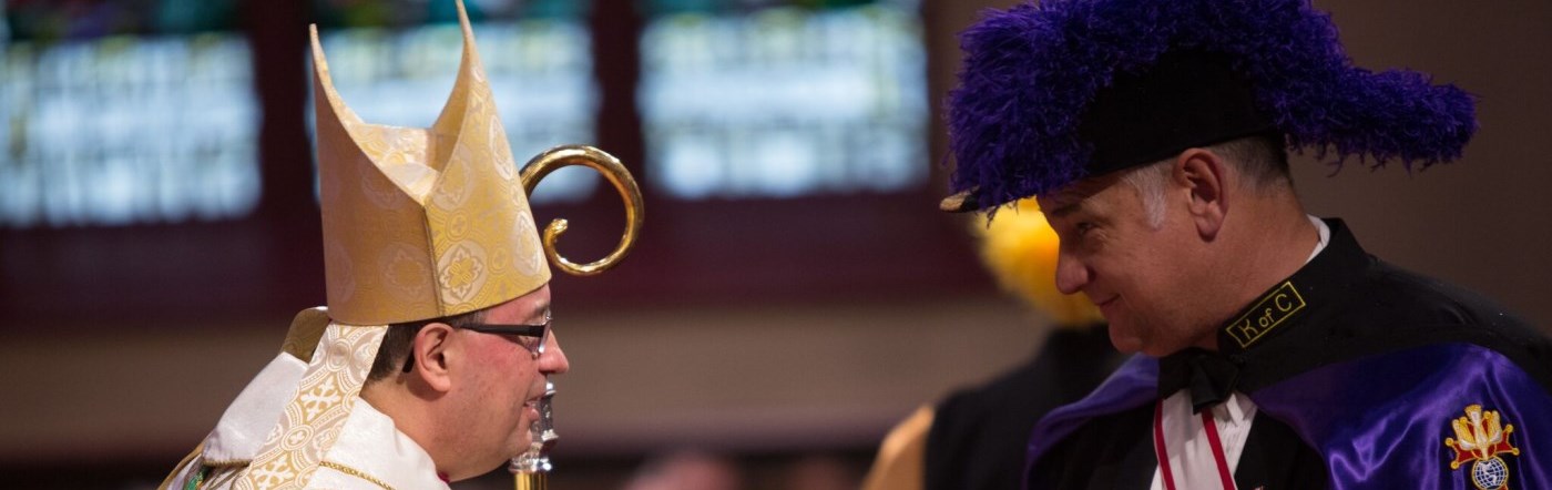Bishop Miehm greeting Fourth Degree Knight of Columbus